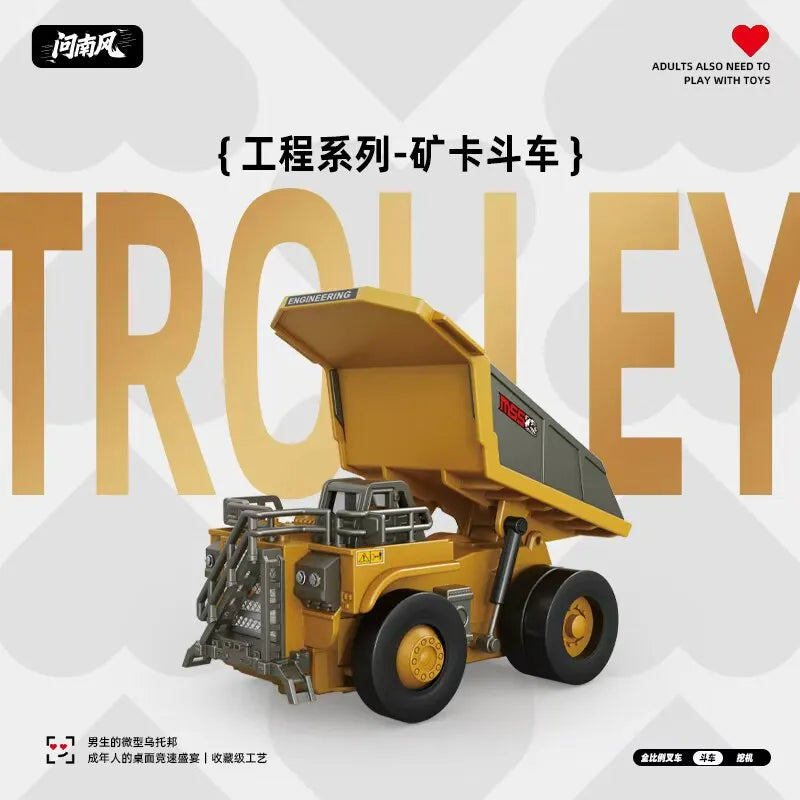 A yellow engineering trolley model vehicle with large wheels and a raised cargo bed.
