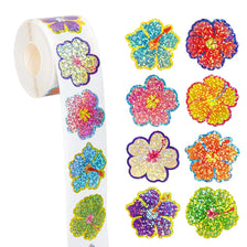 Roll of glitter flower round stickers in various colors for crafts and party favors