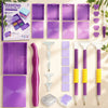A set of modular diamond painting organizers featuring purple and pink slots and dot pens.
