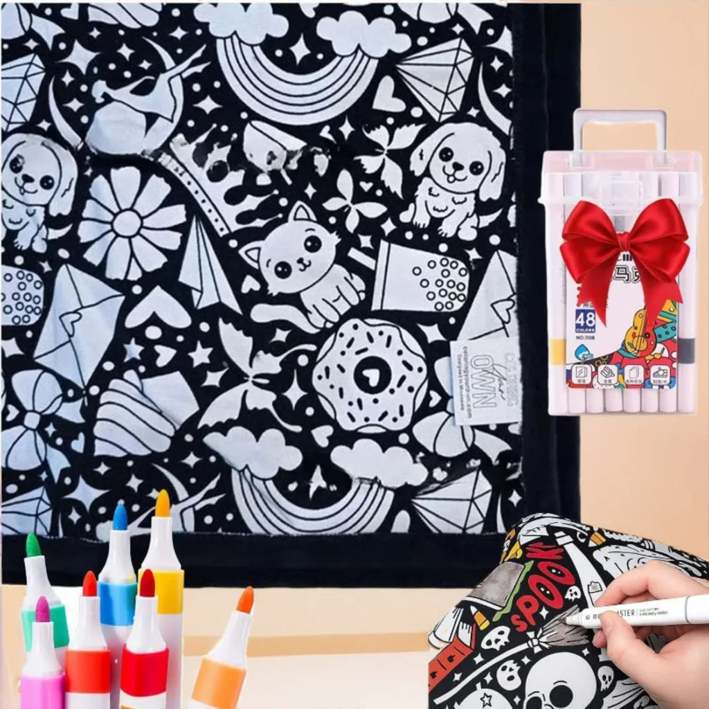 A DIY coloring blanket with 24 markers and a black and white patterned fabric is shown.