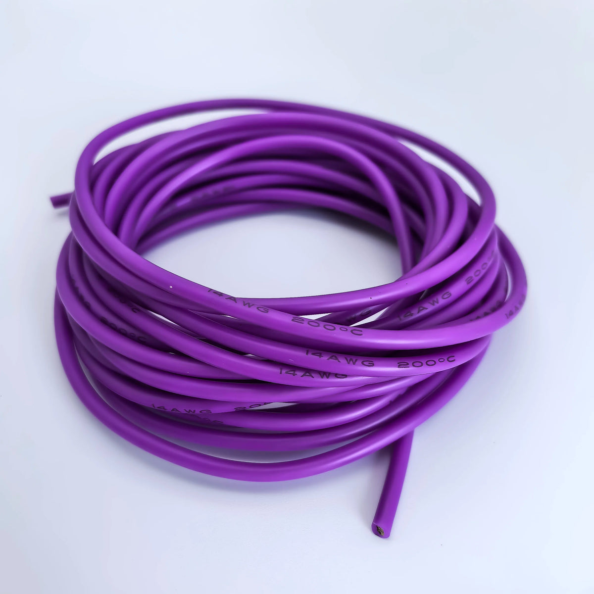 A coil of purple flexible silicone tinned copper wire with various AWG gauges.