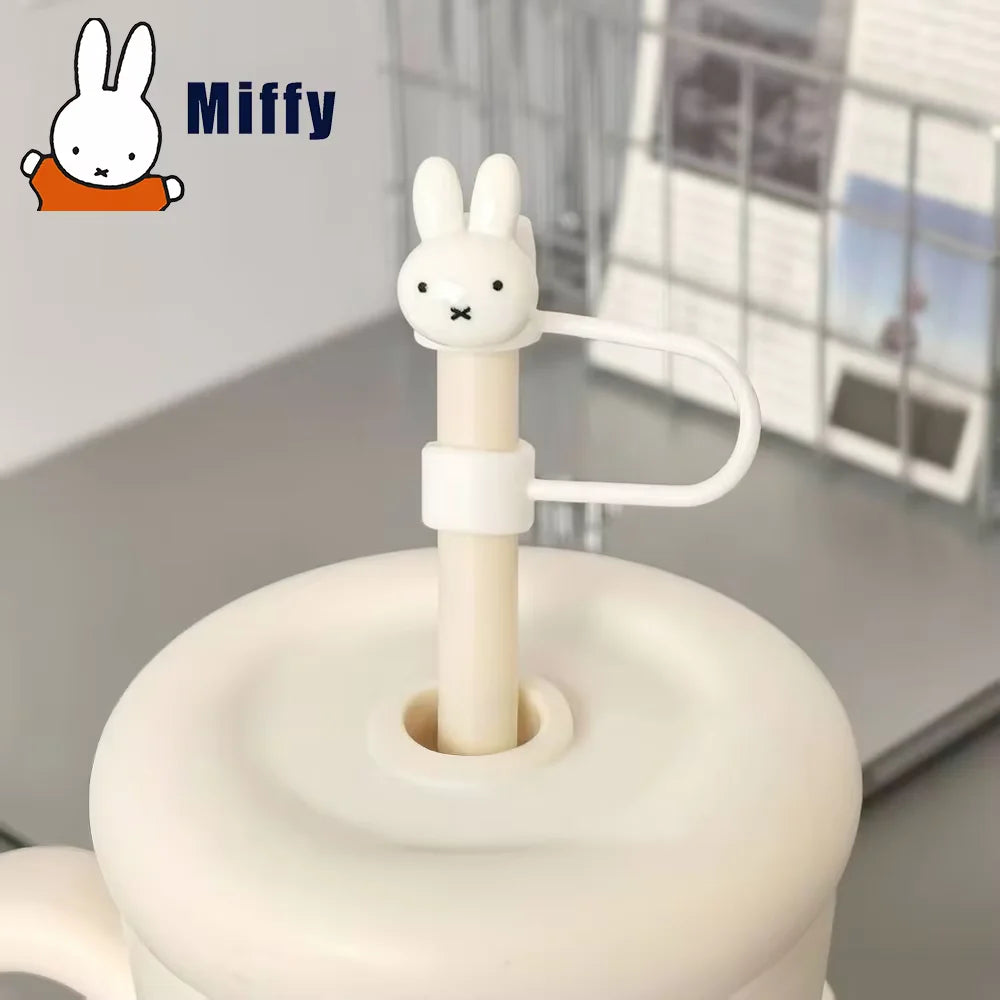 A white Miffy straw topper with a rabbit head design is shown on a reusable straw.