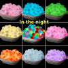 A grid showing glow in the dark silicone beads in various colors including pink, blue, green, yellow, orange, and purple.