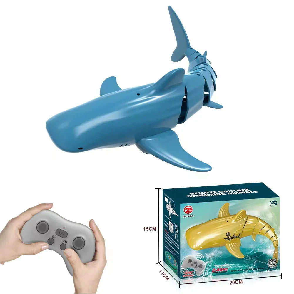 A yellow shark toy is shown next to its remote control and packaging box.