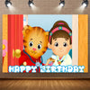 A cute cartoon tiger and a smiling child are featured on a birthday backdrop with a happy birthday text.