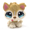 A small, light yellow Bobblehead toy of a deer with large black eyes and pink inner ears.