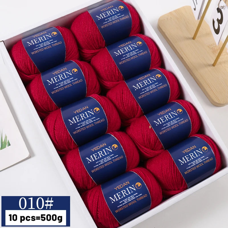 A box of red merino wool yarn balls for knitting sweaters, scarves, and hats