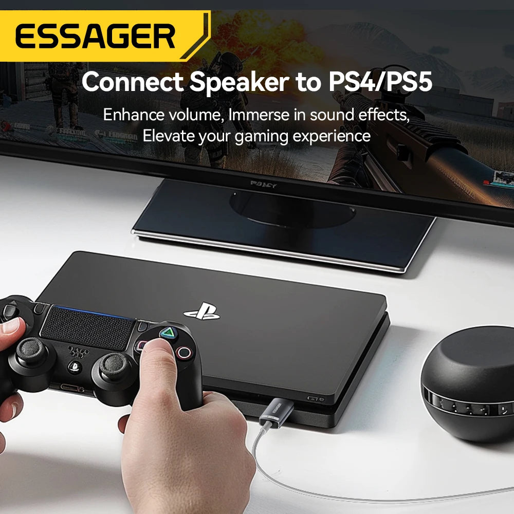 An ESSAGER Connect Speaker adapter is shown next to a PlayStation controller and a black audio device on a desk.