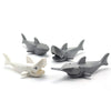 A set of eight gray and white marine creature building blocks.