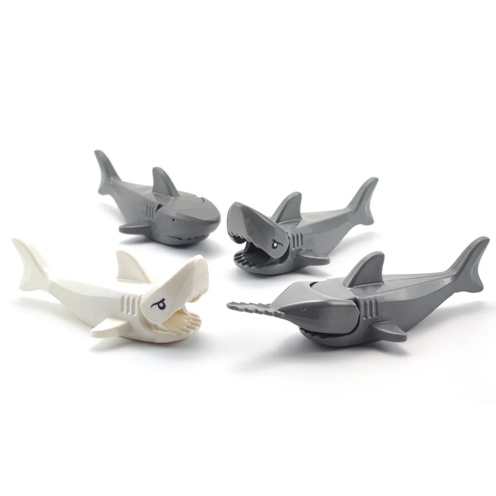 A set of eight gray and white marine creature building blocks.