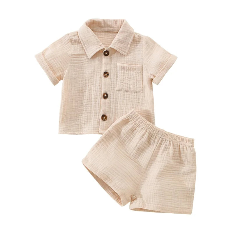 A beige linen shirt and matching shorts outfit set for a baby boy