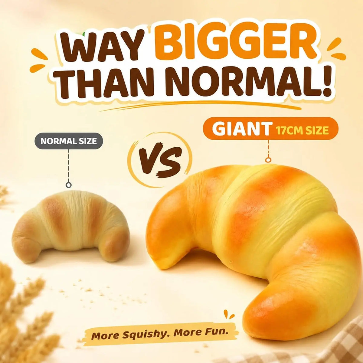A giant croissant toy next to a normal size croissant, demonstrating the difference in size.
