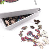A wooden jigsaw puzzle featuring irregular animal-shaped pieces, including a tree of life design.