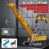 A yellow RC crane truck is shown with a boom, remote control unit, and battery components.