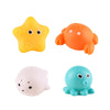 Three glow-in-the-dark animal washing water toys: a yellow star, an orange fish, and a blue blob.