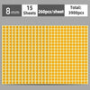 A sheet of round, yellow self-adhesive dot labels with a light orange background.