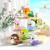 A set of colorful parrot micro building blocks featuring various bird shapes and colors on a wooden surface.