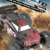 A black and red off-road monster truck RC car is shown driving through dusty terrain.