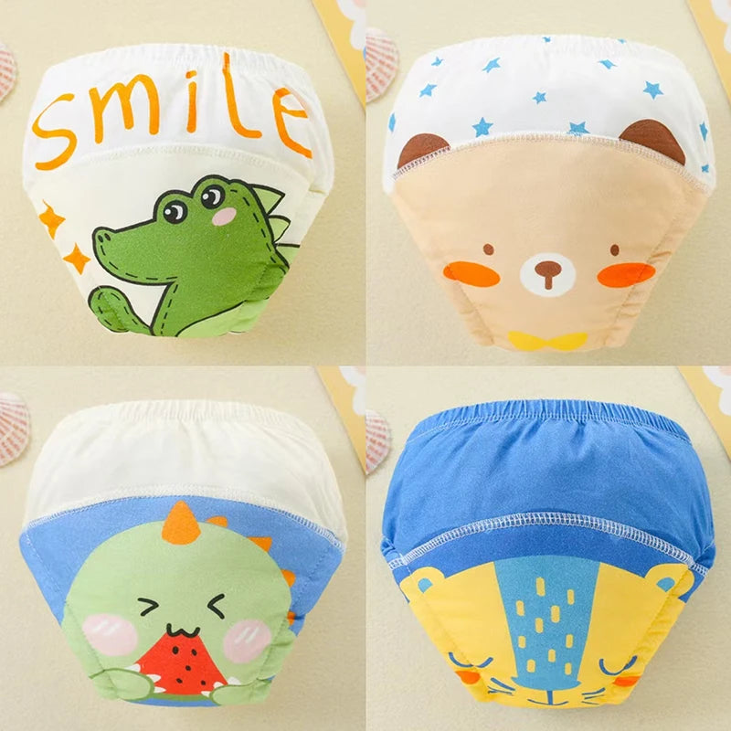 A set of four reusable cotton potty training pants featuring various animal designs including a smiling face, a bear, and a d