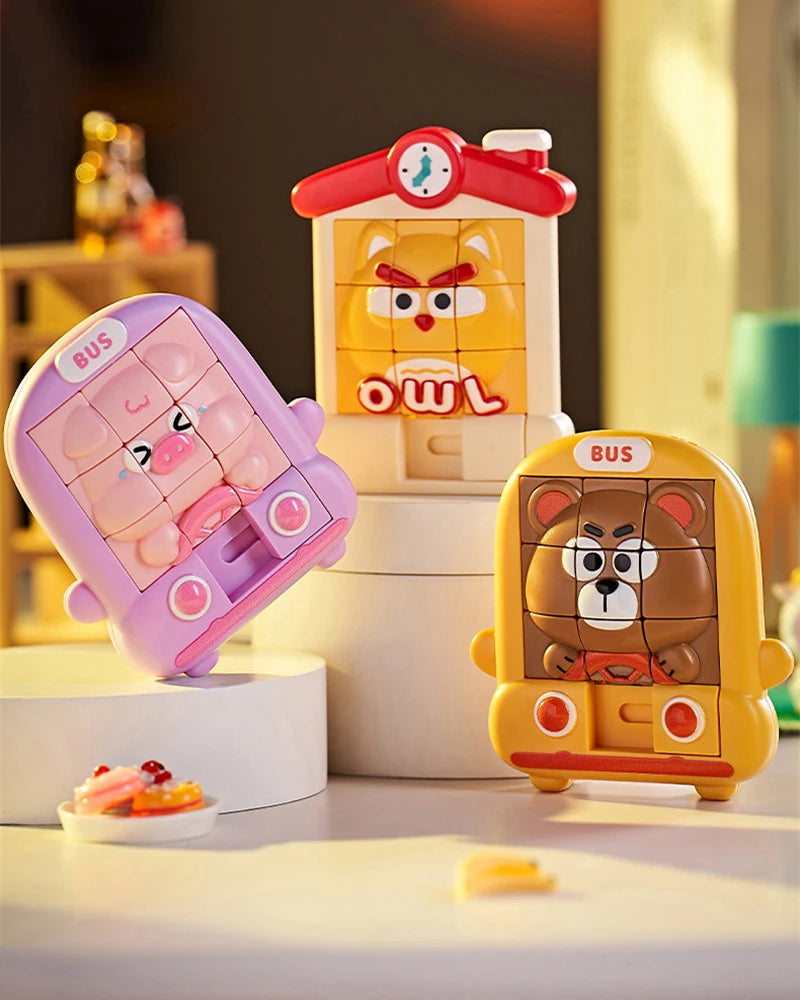 A set of three animal slide puzzles featuring a pig, an owl, and a bear in bright colors.