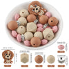 A variety of brown and pink cartoon animal silicone beads are displayed in a white bowl with usage instructions.