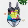 A black and white striped one-piece swimsuit featuring a tropical palm tree and rainbow design.