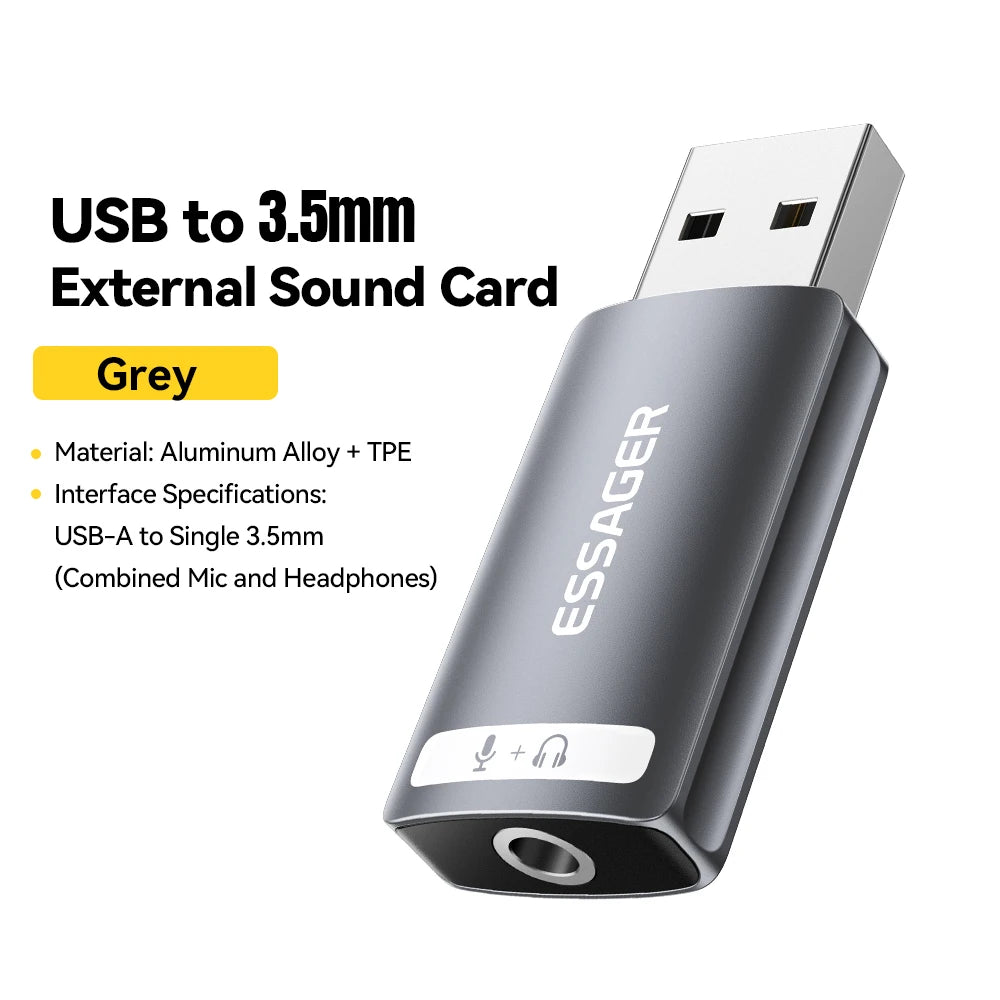 A grey USB to 3.5mm external sound card adapter with microphone and headphone jacks.