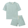 A light mint green kids' summer tracksuit set featuring a short sleeve top and matching shorts.