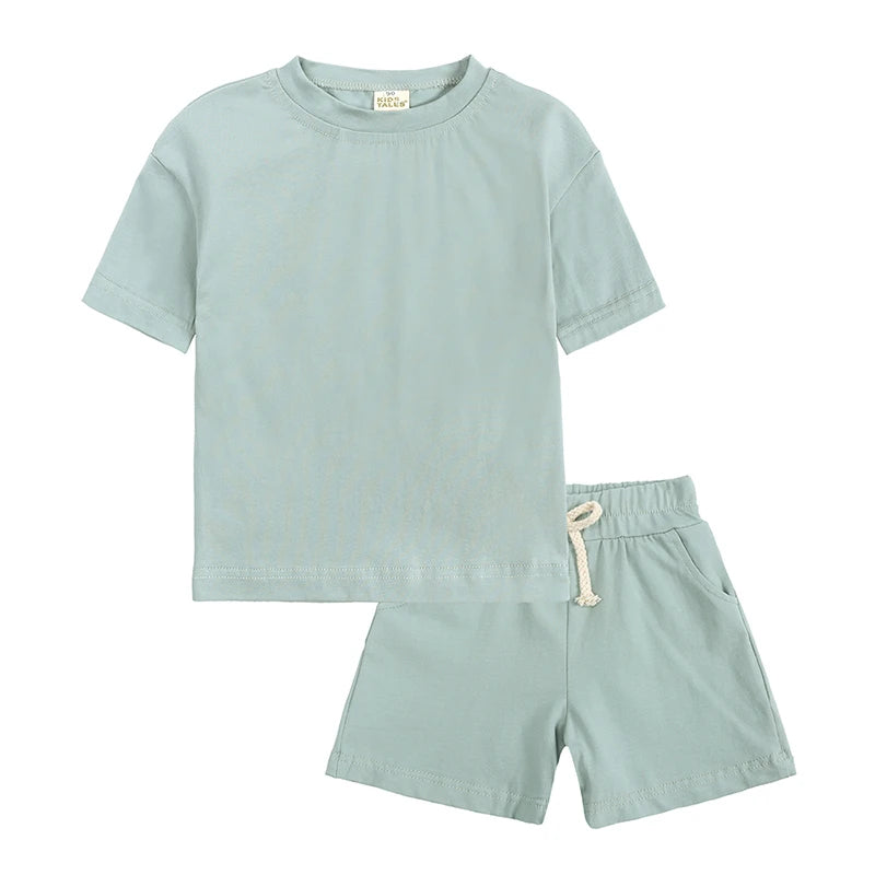 A light mint green kids' summer tracksuit set featuring a short sleeve top and matching shorts.