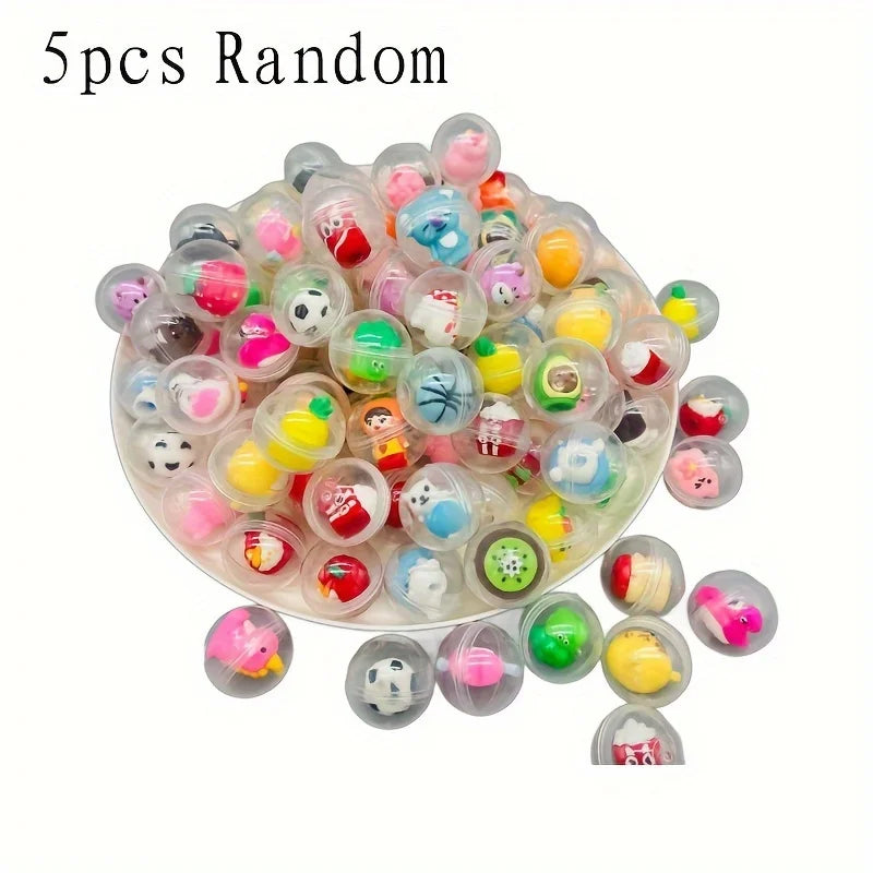 A pile of 5 random kawaii mini capsule figures in various colors and designs.