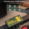 A green portable rechargeable guitar pedal power supply with multiple DC outputs is shown on a wooden surface.