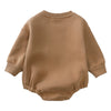 A beige long-sleeved cotton baby romper for boys and girls