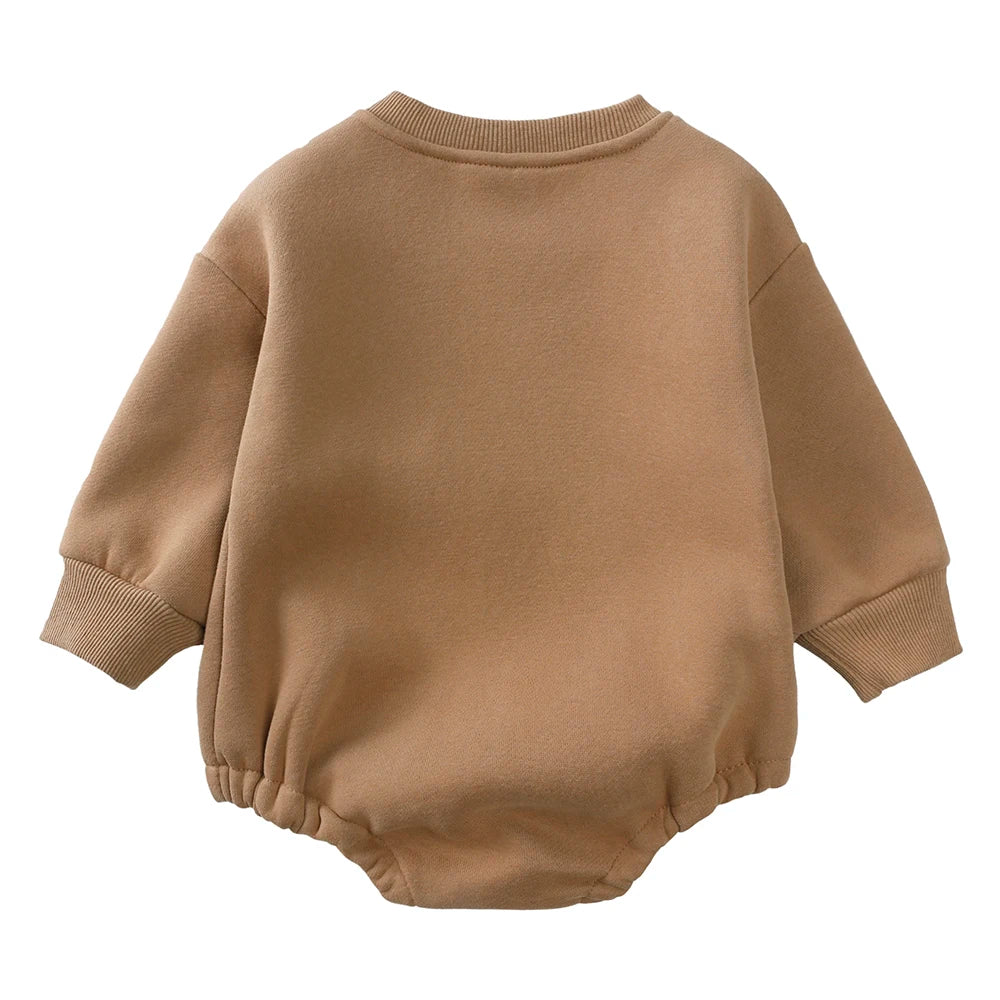 A beige long-sleeved cotton baby romper for boys and girls