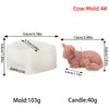 A white silicone mold for a cow candle, next to a finished pink cow candle.