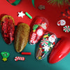 Red and gold festive Christmas polymer clay slices scattered on a red background with green accents.