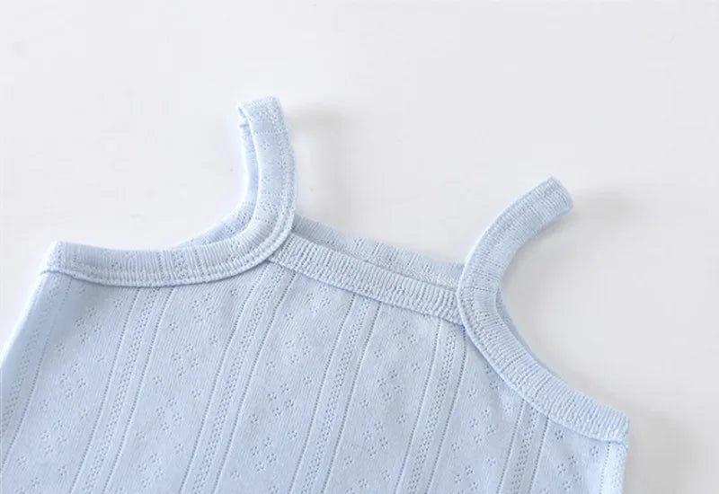 Light blue knitted cotton romper with shoulder straps