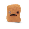 A brown, fuzzy plush toy shaped like a monster with large eyes and a wide mouth.
