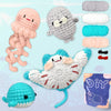 A beginner crochet kit for amigurumi animals showing various yarn colors and finished stuffed animal projects.