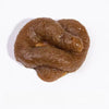 A realistic squishy prank toy shaped like soft fake poop, brown and textured.