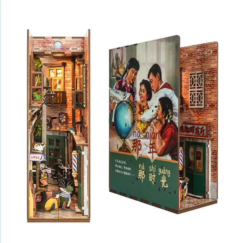 A DIY book nook kit featuring a detailed brick facade with an interior scene and LED lighting.