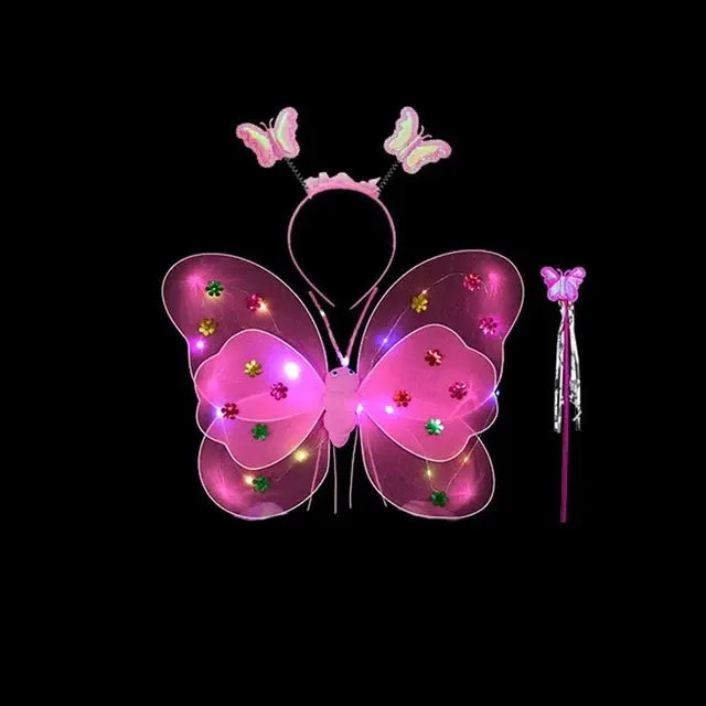 A pink LED butterfly costume set for girls featuring glowing wings, a skirt, and a wand.