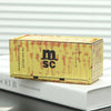 A rectangular yellow storage box with a lid and textured surface is shown resting on a white book.