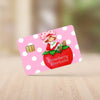 A pink card featuring a strawberry shortcake cartoon illustration on a white background.