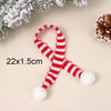 A set of mini knit Christmas hats and scarves featuring red and white stripes with fluffy pom-poms.