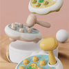 A yellow and white Montessori animal hammer toy with various plastic animals for toddlers is shown on a beige background.