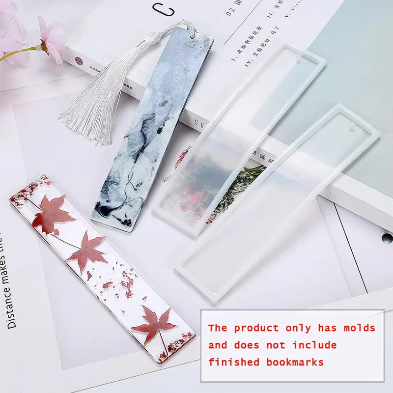 Several flexible silicone molds for resin bookmarks are displayed on a white background.