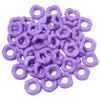 A pile of purple acrylic doughnut spacer beads for jewelry making