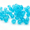 A pile of faceted blue crystal glass beads for jewelry making