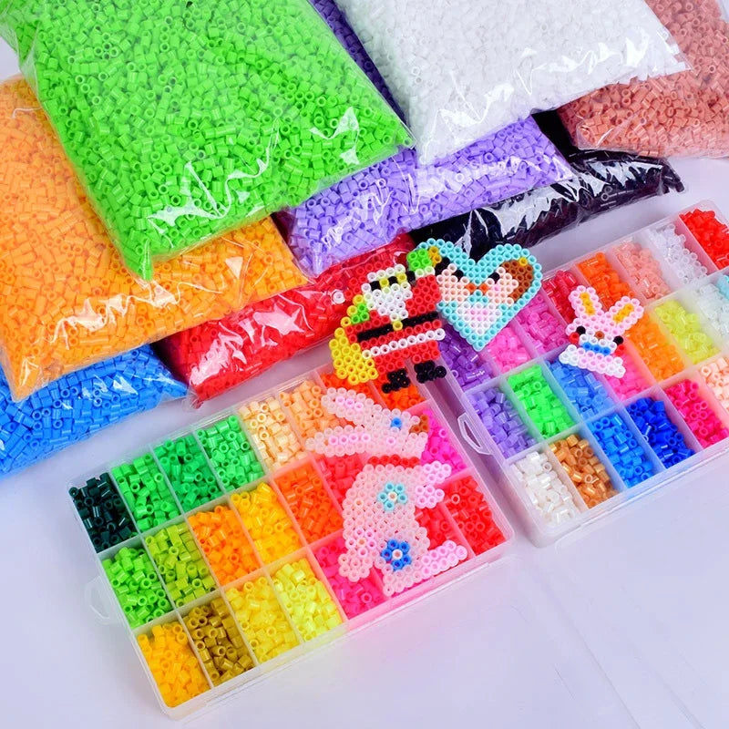 A collection of colorful DIY mini bead sets with templates and keychain accessories in various shades of green, orange, purpl