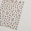 A sheet of nail art stickers featuring small, irregular heart shapes in a nude and gold leopard print pattern.
